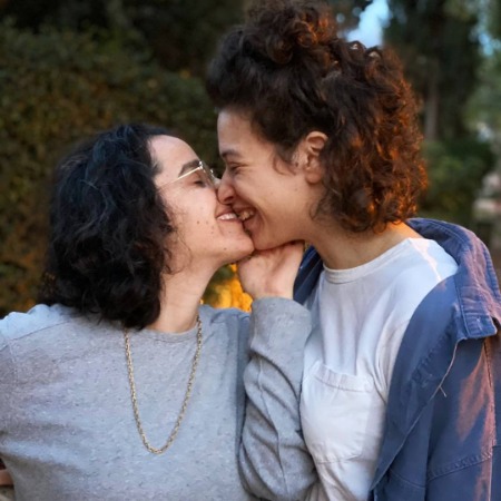 Tamar Amit Joseph and Lior Elefant kissing eachother.